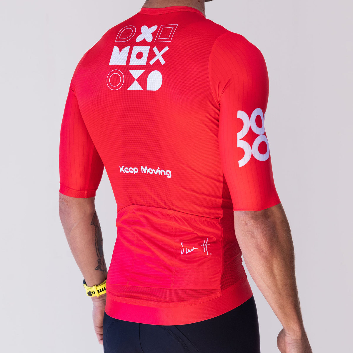 Men's Keep Moving cycling jersey in red, back view with geometric graphic and rear pockets