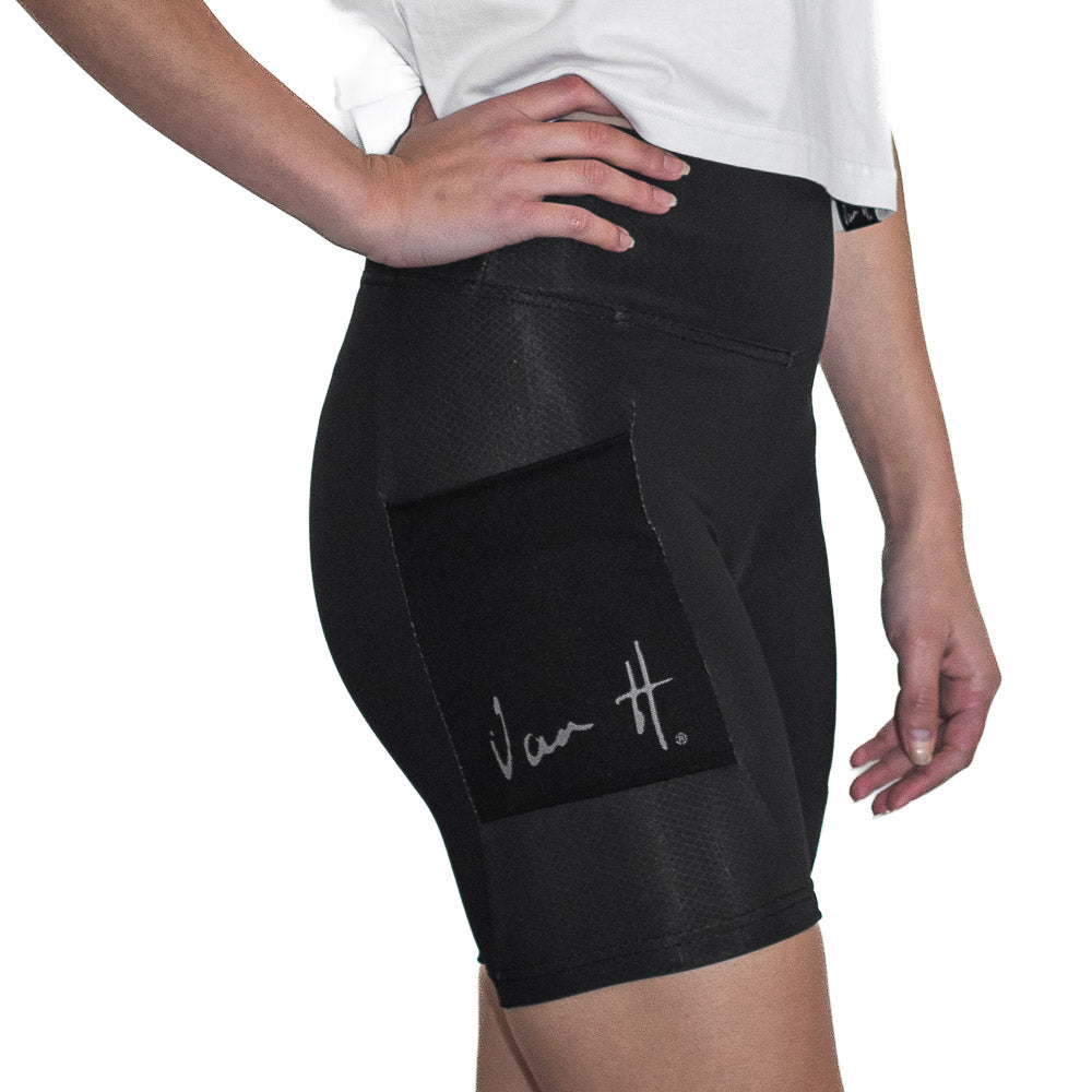 side view of black 6inch inseam tights displaying mesh pocket with van H reflective brandingSportswear, Active wear, running tight, gym tight, exercise tights, South Africa, athletic wear, sports attire, locally made active wear, Van H, mens sportswear, ladies sportswear, tight with pockets